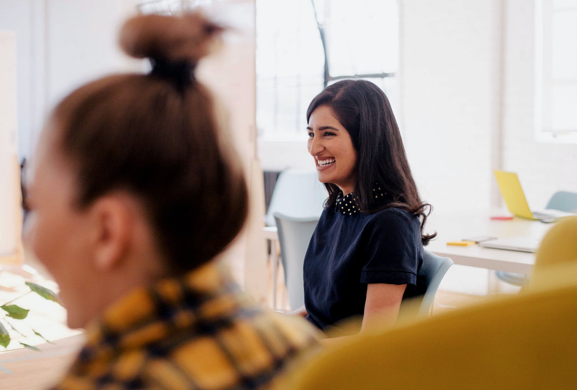 women in office smiling